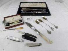 A mixed lot of silver and mother of pearl items including cased button hook & shoe horn,