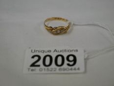 An 18ct gold ring set 5 diamonds, size O.
