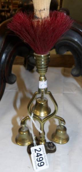 A brass triple bell horse ornament.