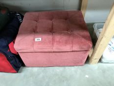 A pink dralon ottoman