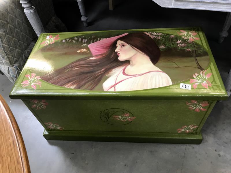 A painted blanket box featuring a lady and flowers
