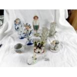 2 pairs of figures, a Victorian Welsh tea party fairing, a match striker and other items.