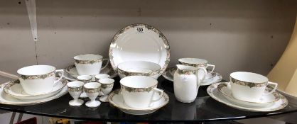 A Limoges France tea set plus egg cups, milk, sugar,