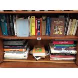 2 shelves of books including Enid Blyton