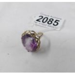 A 9ct gold ring set amethyst coloured stone, size O half.