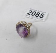 A 9ct gold ring set amethyst coloured stone, size O half.
