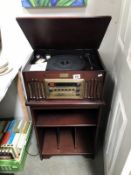 A vintage collection gramophone with a record cabinet