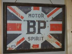 A retro BP Motor Spirit sign in old frame.