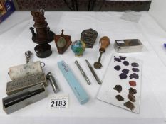 A collection of desk stationary items including roller blotter, stamp moisture,