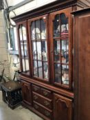 A mirror back display cabinet on cupboard base