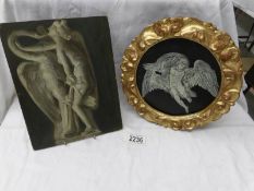 A circular gilt framed study of an angel and a classical scene.