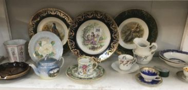 A mixed lot of china including plates, teapot etc.