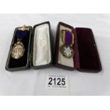 2 'Oddfellows' medals in cases.