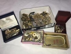 A box of yellow metal costume jewellery, cuff links, tie clips etc.