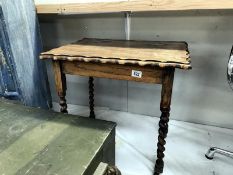 A 1930's oak side table with barley twist legs