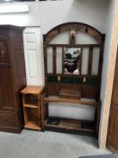 An Edwardian oak hall stand with tiled and mirrored back