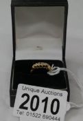 An 18ct gold ring set 5 diamonds.