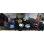 11 assorted items of coloured glassware including vases, paperweights etc.