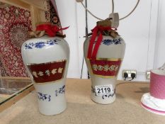 2 blue and white Chinese bottles (one with contents).