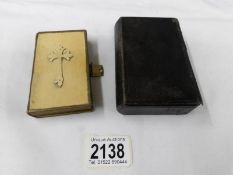 An 1897 prayer book and a book of common prayer.