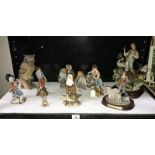 A shelf of figures including Capodimonte, Meridian etc.