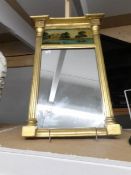 A 19th century gilt framed Palladian style mirror with hand painted panel to top.