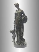 An antique bronze figure of a Grecian lady with a child.