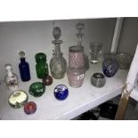 A mixed lot of glassware including decanters, scent bottles and paperweights etc.