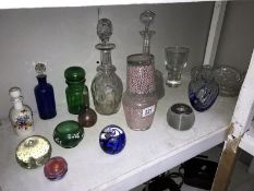 A mixed lot of glassware including decanters, scent bottles and paperweights etc.