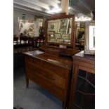 An Edwardian mahogany inlaid dressing table.