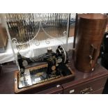 A cased Singer sewing machine in good clean condition