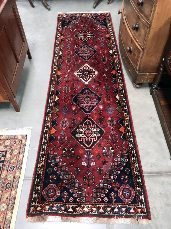 A Persian carpet/runner