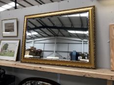 A framed bevel edge mirror