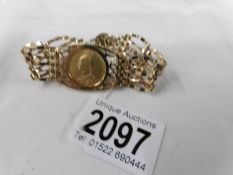 A Victorian 1888 sovereign mounted in a 9ct gold gate bracelet.