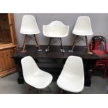 4 Eames plastic chairs and 1 rocker by Charles & Ray Eames No.