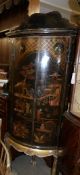 A Japanese lacquered corner cupboard.