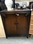 A 1950's oak cupboard