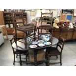 A darkwood stained table and 4 chairs