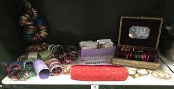 A shelf of decorative bangles and a quantity of face jewellery by Sweetgirl, Sitara etc.