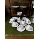 Approximately 26 pieces of rose decorated tea ware.