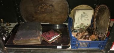 A shelf of wooden items and vintage photo albums etc.