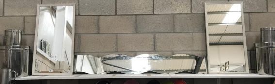 A pair of rectangular framed mirrors (87cm x 45cm) and a pair of unframed wave shaped mirrors