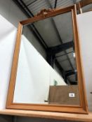A bevel edged framed mirror