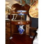 A Victorian mahogany corner washstand with modern blue and white jug and basin set.