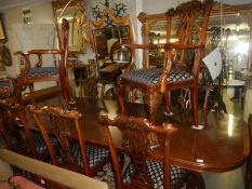 A mahogany extending dining table and set of 8 chairs,