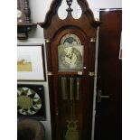 A Sligh Grandfather clock with keys, weights, pendulum and original receipt.