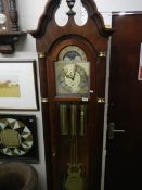 A Sligh Grandfather clock with keys, weights, pendulum and original receipt.