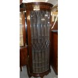 A tall mahogany astragal glazed corner cabinet.