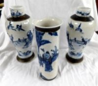 A pair of oriental blue and white vases ( 1 a/f) and another blue and white vase (a/f) all with