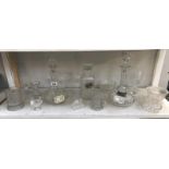 3 glass decanters with labels and glassware